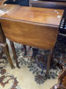 Small Victorian mahogany drop leaf sewing table raised on turned legs with brass casters, 45cm wide,