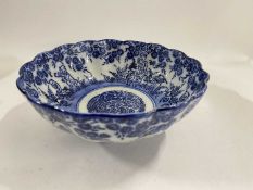 Japanese porcelain bowl of fluted shape with blue and white design of children amongst flowers, 18cm