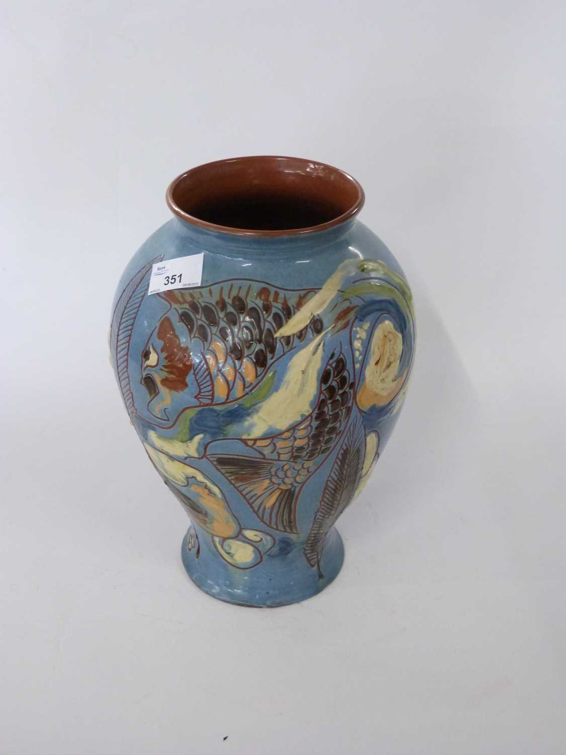 An early 20th Century Barum pottery fish vase with incised signature to base and date 1902, 32cm