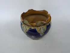 Royal Doulton jardiniere, the blue ground with tube lined Art Nouveau style decoration, 20cm