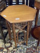 Small Arts & Crafts style oak hexagonal topped table raised on a simulated Moorish style and faux