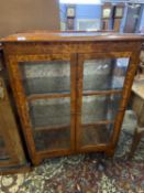 Early 20th Century burr/walnut veneered two door display cabinet raised on bracket feet, 78cm