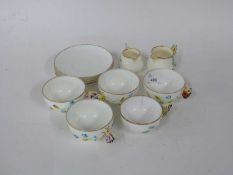 Group of tea wares with butterfly handles (a/f), saucers stamped Moore Bros