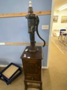 An unusual Simon Simpson of Norwich combination lamp and side cabinet, the lamp formed from a
