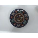 An Oriental Cloisonne dish the centre decorated with a phoenix within stylised borders