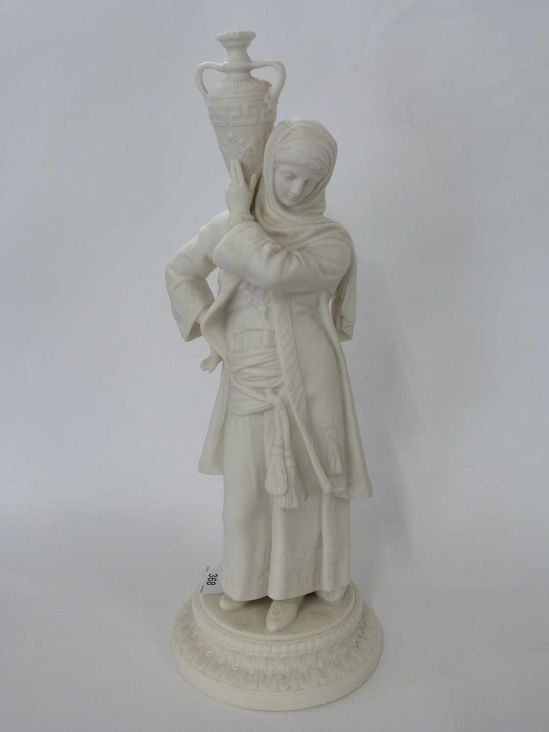 A Royal Worcester style parian figure of a water carrier on circular base, 42cm high