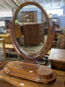 Large Victorian dressing table mirror of oval form set on a base with single freize drawer, 86cm