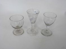 Collection of three wine glasses in 18th Century style one with trumpet bowl with an engraving and