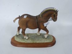 Border Fine Arts model of a ploughing horse or Shire horse on shaped wooden base, 24cm long