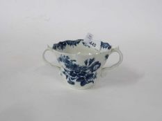 Worcester porcelain chocolate cup, shaped rim decorated with blue printed designs (a/f)
