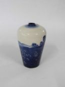 An unusual Doulton flambe baluster vase decorated with a country scene in blue, 14cm high