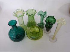 Group of green glass wares comprising a vase, further spill vase, two vaseline green vases and small