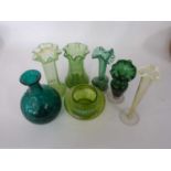 Group of green glass wares comprising a vase, further spill vase, two vaseline green vases and small