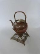 Copper kettle on copper twig like stand