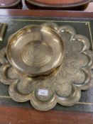 Group of three pieces of Indian brass ware comprising two lobed serving trays and a shallow circular