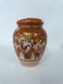 Japanese porcelain jar and cover, the tangerine ground decorated with sages, cover with gilt