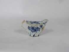 Lowestoft butter boat of Low Chelsea ewer form with painted blue and white decoration