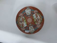 An unusual Japanese porcelain dish of shaped form with panels decorated with birds on branches,