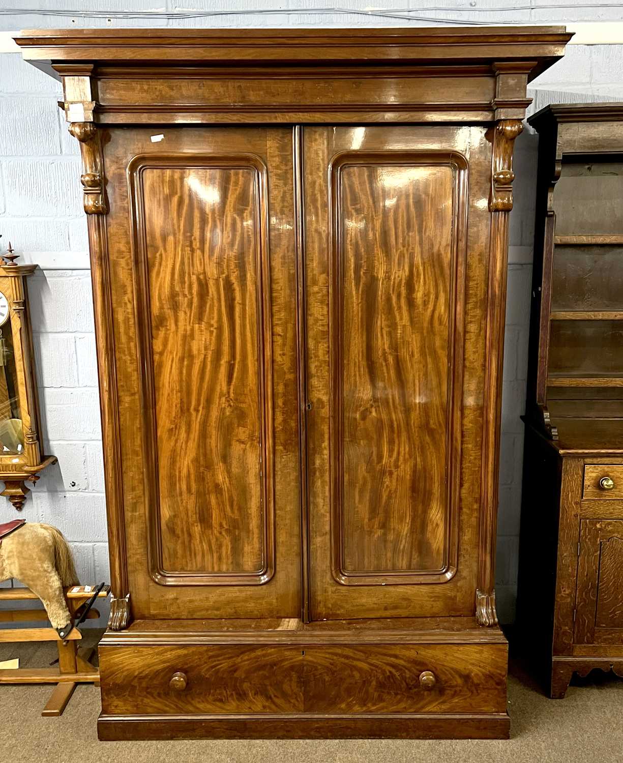 A large Victorian mahogany wardrobe with architectural cornice over two panelled doors and a base, - Image 2 of 5