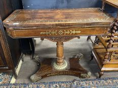 Regency rosewood and brass inlaid card table, the folding top with green baize lined interior raised