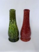 Two Burmantofts faience vases of cylindrical form, one with a red glaze and the other in green, 38cm