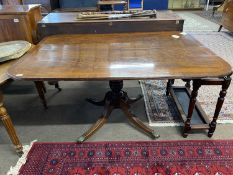 19th Century mahogany rectangular tilt top pedestal dining table raised on a turned column with four