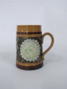 Doulton Lambeth jug with a Happy New Year message, the jug decorated with green glazed circular