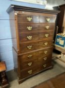 A Georgian mahogany chest on chest, the top section with moulded and dental cornice with two short