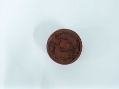 Chinese red lacquer circular box with design of flowers to the cover, 7cm diameter