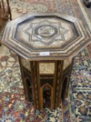An early 20th Century Middle Eastern occasional table, the octagonal top inset with a star
