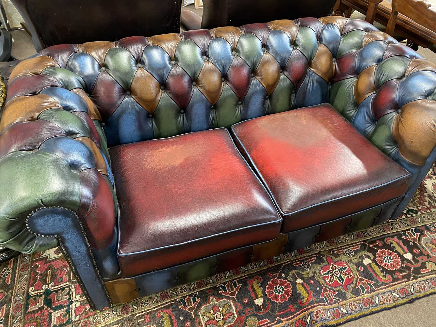 Multi coloured leather Chesterfield two seater sofa, 160cm wide, 85cm deep and 70cm high