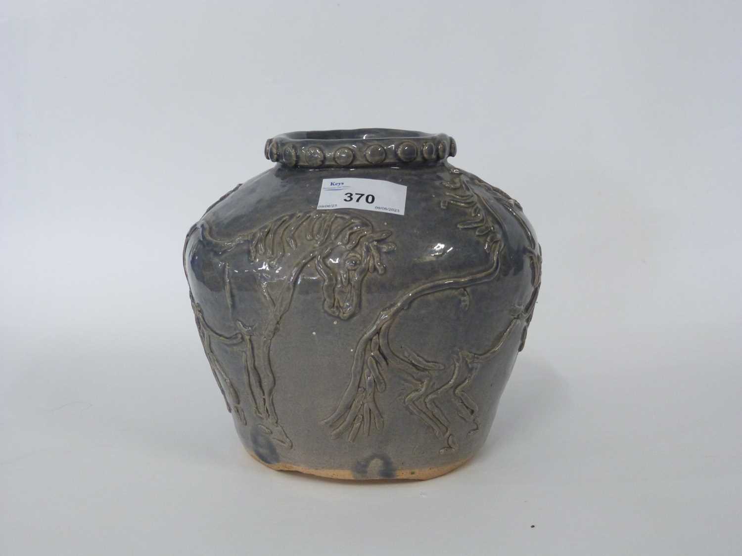 Studio Pottery vase, the grey ground decorated in relief with horses, possibly five horses of Mu
