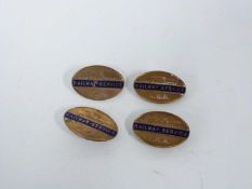 Small box containing four railway badges with enamel sign entitled Railway Service LMS made by