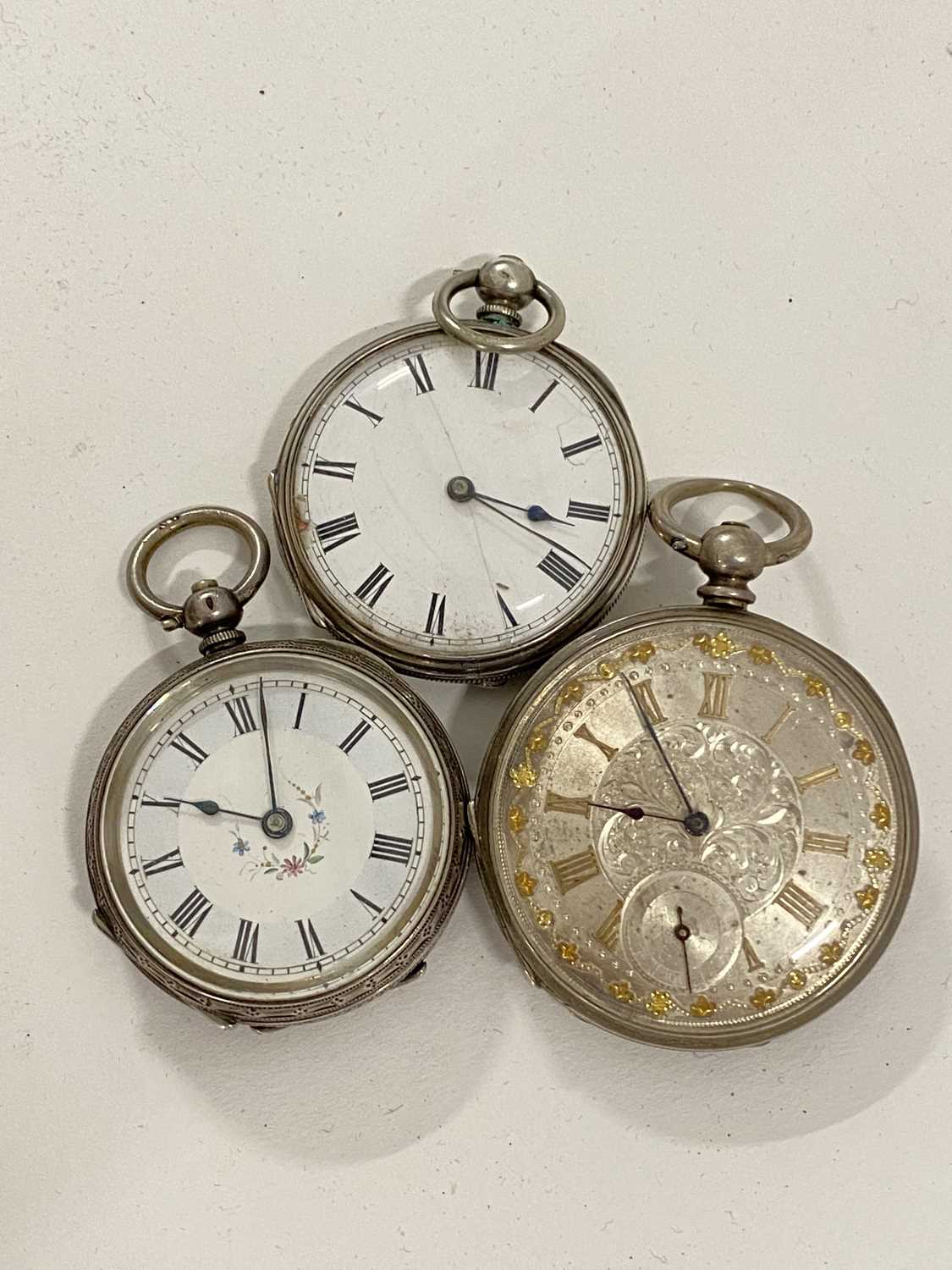 Group of three various continental key wound pocket watches, one case marked Fine Silver, another