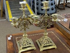 A pair of late 19th Century asthetic style brass three light candelabra with pierced decoration