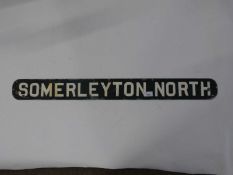 A railway sign for Somerleyton North, with white lettering on green background, 92cm long