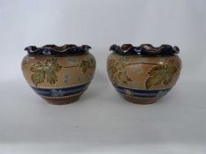 Pair of Royal Doulton jardinieres with crimped rims, the body with applied floral decoration on a