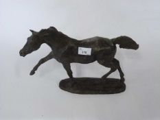 A resin horse with bronzed finish