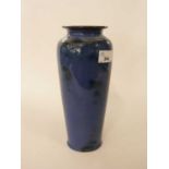 An unusual Royal Doulton blue ground vase with brown smudged decoration, 27cm high