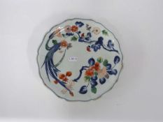 Japanese porcelain dish with shaped rim decorated with polychrome design of floral sprays (some