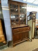 A Georgian mahogany secretaire bookcase cabinet with glazed top section over a base with