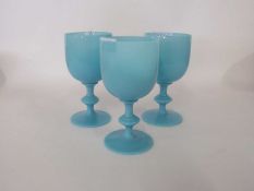 Group of three late 19th Century glass rummers in a pale blue colour, the large bowl above a stem