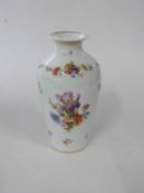 Continental porcelain vase in balustre form decorated with flowers, 19cm high