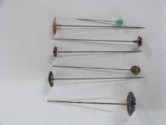 Series of hat pins, some with enamelled decoration