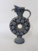 German Rhenish type stone ware ewer with a circular body and spout modelled as an eagle's beak, 34cm