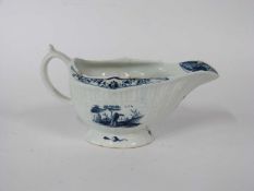 Lowestoft porcelain sauce boat with painted blue designs