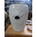Chinese blanc de chine garden seat, the top decorated in relief with flowers, 45cm high