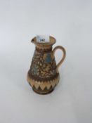 19th Century Doulton Lambeth jug, the buff body with an applied brown and green florets, 15cm high