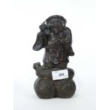 A Chinese bronze of Hoti, 20cm high