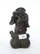 A Chinese bronze of Hoti, 20cm high